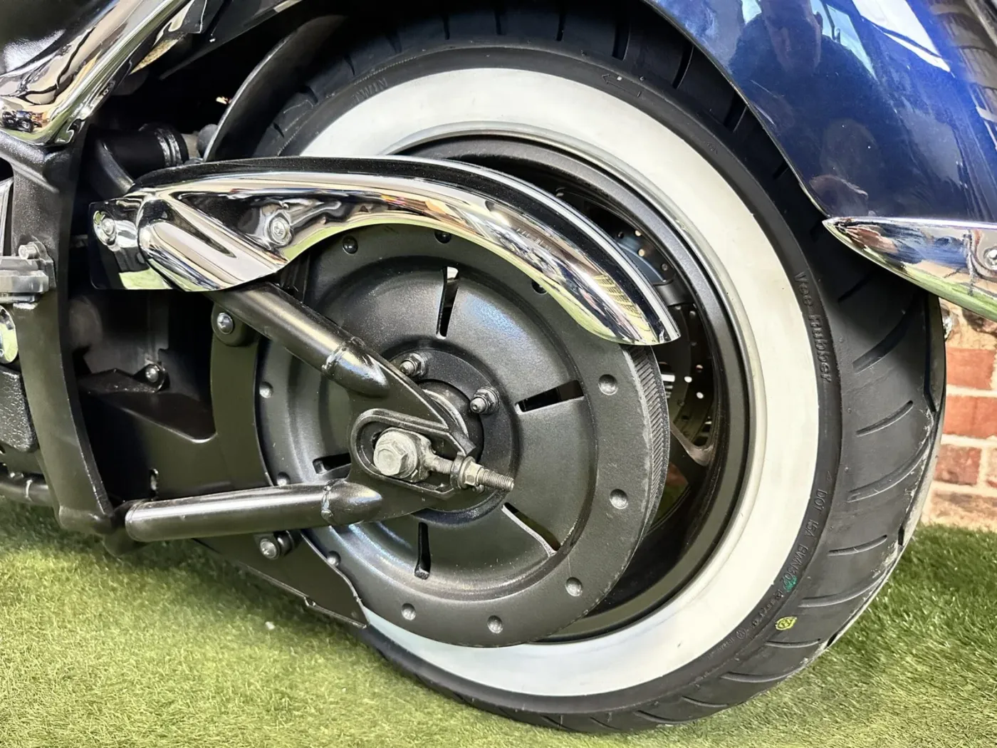 Rear wheel, enclosed belt final-drive and rear disc