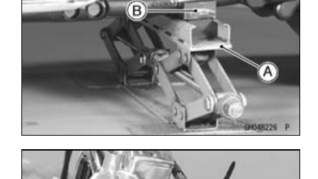 Rear of the frame supported on the special jack and jack attachment during engine removal, with callouts.