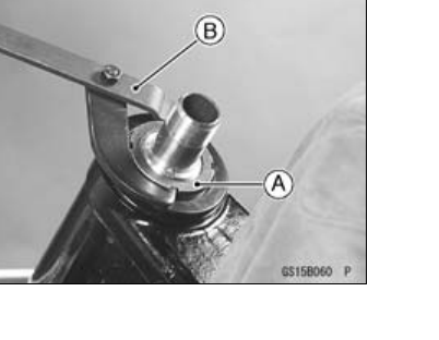 Steering-stem nut being turned with the stem-nut wrench special tool to set the head-bearing preload.